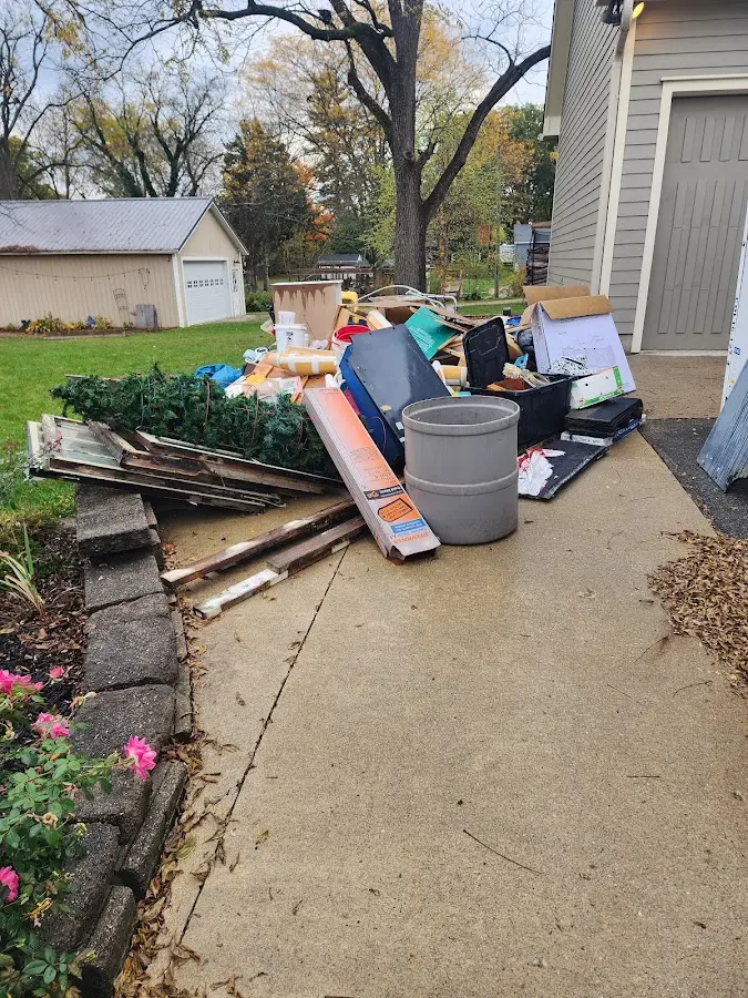 Dumpster being loaded with debris for 3 Yard Dumpster Rental in Titusville